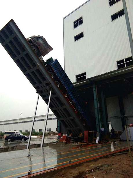 自動(dòng)液壓翻板卸車機(jī)