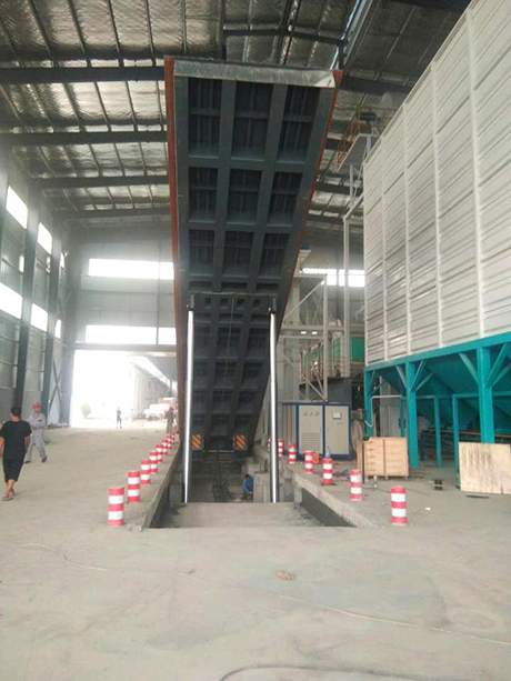 自動(dòng)液壓翻板卸車機(jī)